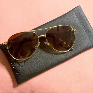Women sunglasses(by Oscar de le renta) gold trim-brown lenses
